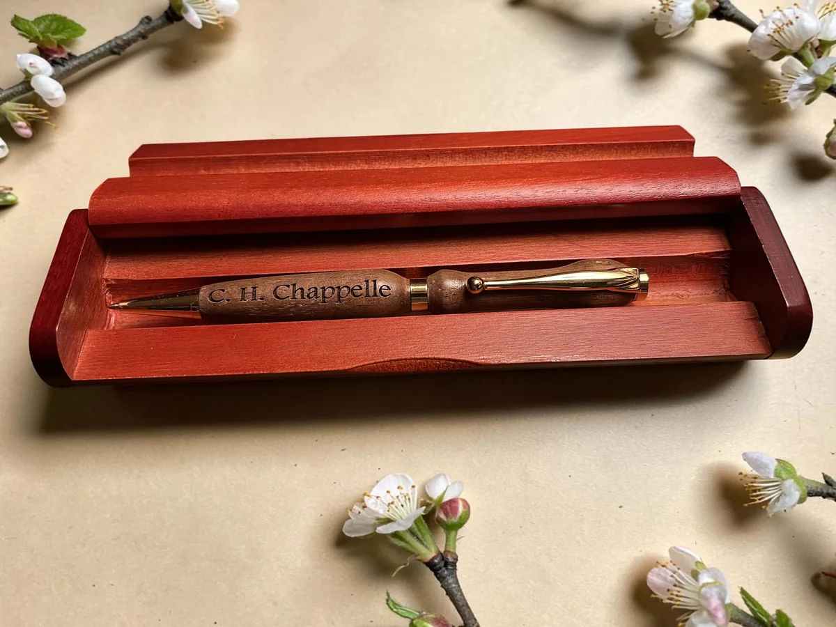 Personalized red wood pen set shown open with engraved pen